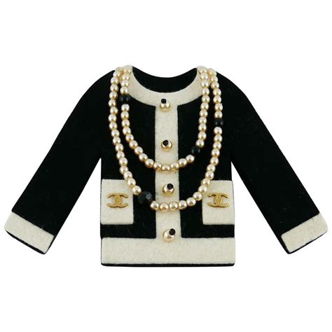 chanel briche|Chanel jacket brooch.